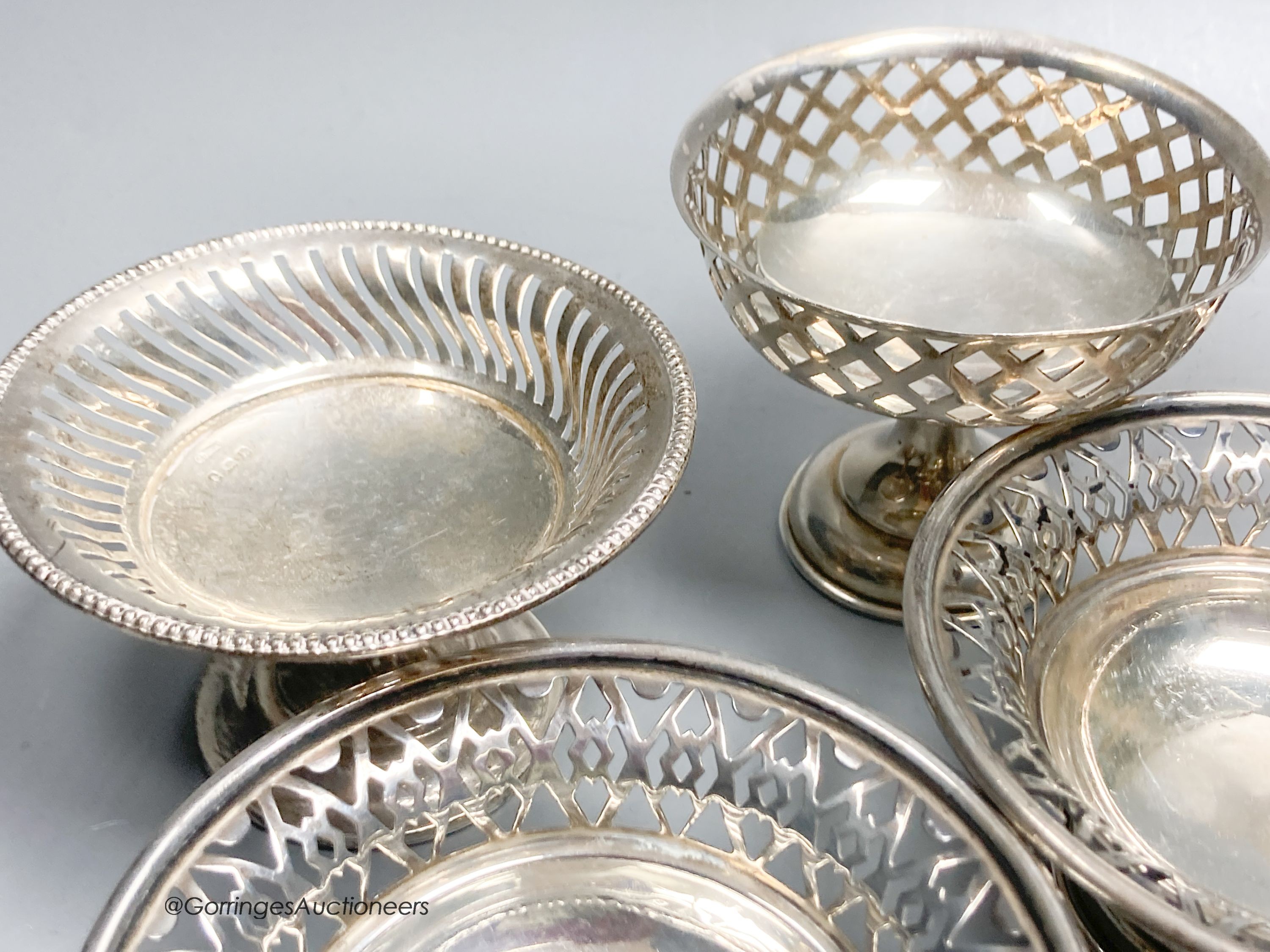 A group of assorted small silver etc. including two pairs of nit dishes, christening mug, spill vase, chamberstick, pair of dwarf candlesticks, pedestal dish, carving set and cased textured cup